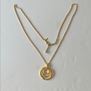 Gold-Tone tiered concentric circle pendant necklace.